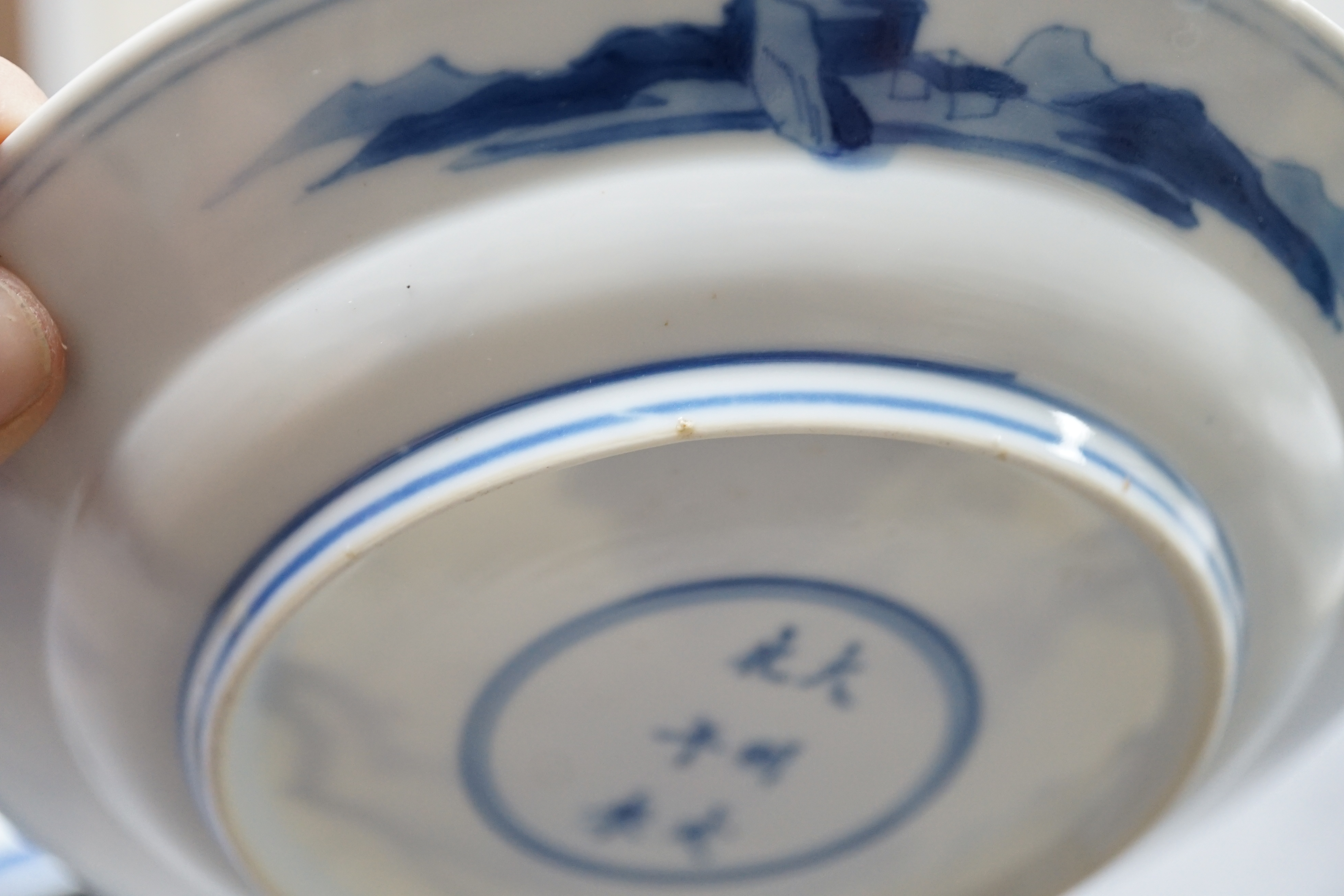 A pair of Chinese blue and white small plates, Kangxi period, hairline cracks to one plate.